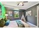 Playful bedroom featuring a window, teepee, artwork, and colorful decor at 905 8Th Sw Ave, Largo, FL 33770