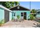 Back exterior view of the renovated shed with new door, seating area and RV parking at 905 8Th Sw Ave, Largo, FL 33770