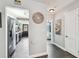 Hallway features a view of the modern kitchen and stainless steel refrigerator with access to the bedroom at 905 8Th Sw Ave, Largo, FL 33770