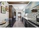 Stylish kitchen boasts modern cabinetry, stainless steel appliances, and a unique tile backsplash at 905 8Th Sw Ave, Largo, FL 33770