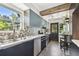 Bright, modern kitchen with stainless appliances, and a window that lets in lots of natural light at 905 8Th Sw Ave, Largo, FL 33770