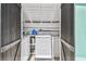 Inside the shed you'll find a laundry area with washer, dryer and storage shelving at 905 8Th Sw Ave, Largo, FL 33770