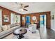 The spacious living room features stylish decor, offering a comfortable gathering space for relaxation and entertainment at 905 8Th Sw Ave, Largo, FL 33770