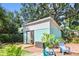 Exterior of the renovated shed with seating area, brick patio and plants at 905 8Th Sw Ave, Largo, FL 33770