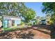 Full view of the backyard with shed, parking area and firepit at 905 8Th Sw Ave, Largo, FL 33770