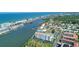 Breathtaking aerial view of a waterfront community with stunning beach access, docks, and condos at 10216 Regal Dr # 310, Largo, FL 33774