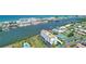 Beautiful aerial view of waterfront condo community featuring lush landscaping and community amenities at 10216 Regal Dr # 310, Largo, FL 33774