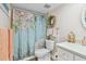Bathroom with a floral shower curtain and decorative wreath at 10216 Regal Dr # 310, Largo, FL 33774