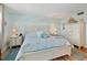 Relaxing primary bedroom with a king bed, matching nightstands, and coastal-themed decor at 10216 Regal Dr # 310, Largo, FL 33774