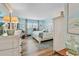 Serene bedroom featuring a comfortable king bed, soft lighting, and stylish decor at 10216 Regal Dr # 310, Largo, FL 33774