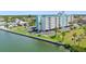 Coastal condominium with lush landscaping, waterside frontage, and convenient parking at 10216 Regal Dr # 310, Largo, FL 33774