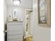 Hallway featuring a white dresser and nautical décor at 10216 Regal Dr # 310, Largo, FL 33774