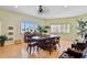 Sunlit meeting room with comfortable seating, piano, and large windows at 10216 Regal Dr # 310, Largo, FL 33774