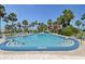 Community swimming pool offering residents refreshing water and surrounding lounge seating at 10216 Regal Dr # 310, Largo, FL 33774