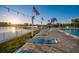 Tranquil pool deck with lounge chairs overlooking the picturesque waterfront at 10216 Regal Dr # 310, Largo, FL 33774