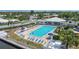 Community pool surrounded by ample seating and palm trees offers a great place to relax in the sun at 10216 Regal Dr # 310, Largo, FL 33774