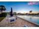 Relaxing pool area with ample seating and serene views of the complex at 10216 Regal Dr # 310, Largo, FL 33774