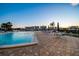 Inviting pool area featuring a pool, lounge seating, and community views at 10216 Regal Dr # 310, Largo, FL 33774