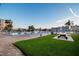 Inviting outdoor pool area with comfortable seating and lush landscaping at 10216 Regal Dr # 310, Largo, FL 33774