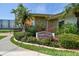 Attractive Imperial Point community signage amidst colorful, manicured landscaping at 10216 Regal Dr # 310, Largo, FL 33774