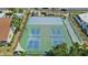 Overhead shot of tennis and basketball courts with mature landscaping and sun shades at 10216 Regal Dr # 310, Largo, FL 33774