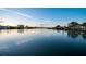 Expansive waterfront view showcasing the calm waters, docks, and distant buildings under a blue sky at 10216 Regal Dr # 310, Largo, FL 33774