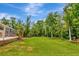 Expansive backyard features lush greenery, providing privacy and tranquility at 10305 Worthy Lamb Way, New Port Richey, FL 34654