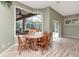 Bright dining area overlooking screened pool at 10305 Worthy Lamb Way, New Port Richey, FL 34654