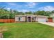 Inviting single-story home featuring a lush front lawn and a convenient two-car garage at 10305 Worthy Lamb Way, New Port Richey, FL 34654