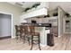 Eat-in kitchen with stainless steel appliances and bar seating at 10305 Worthy Lamb Way, New Port Richey, FL 34654