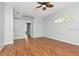 A living room with hardwood floors and a ceiling fan at 10305 Worthy Lamb Way, New Port Richey, FL 34654