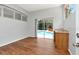 Bright living room featuring sliding glass doors to pool and full wet bar at 10305 Worthy Lamb Way, New Port Richey, FL 34654