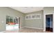 Living room with sliding glass door to pool at 10305 Worthy Lamb Way, New Port Richey, FL 34654