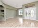 The living room boasts wood floors and unique double door entry at 10305 Worthy Lamb Way, New Port Richey, FL 34654