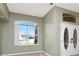 The living room has wood floors and double doors at 10305 Worthy Lamb Way, New Port Richey, FL 34654
