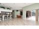 Open living room connects kitchen and dining area at 10305 Worthy Lamb Way, New Port Richey, FL 34654