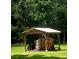 Open wood shed in lush yard, filled with firewood and space for equipment storage at 10305 Worthy Lamb Way, New Port Richey, FL 34654