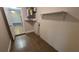 Basement room featuring tile floors and a hot water heater at 11259 Elgin Blvd, Spring Hill, FL 34608
