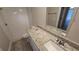Bathroom featuring a walk-in shower and granite vanity at 11259 Elgin Blvd, Spring Hill, FL 34608