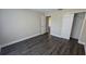 Bright bedroom showcasing modern flooring, neutral paint, and a closet for ample storage at 11259 Elgin Blvd, Spring Hill, FL 34608