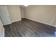 Neutral bedroom featuring modern flooring and a walk-in closet at 11259 Elgin Blvd, Spring Hill, FL 34608