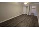 Modern bedroom featuring modern flooring and a walk-in closet at 11259 Elgin Blvd, Spring Hill, FL 34608