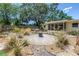 Spacious backyard with pea gravel, xeriscaping, outdoor fire pit and tranquil garden, creating a serene retreat at 11376 119Th Ter, Largo, FL 33778