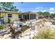 Backyard oasis with patio seating, unique hardscape, and a screened-in porch, perfect for enjoying the outdoors at 11376 119Th Ter, Largo, FL 33778