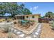 Landscaped backyard with flourishing garden beds and unique hardscape, creating a tranquil outdoor space at 11376 119Th Ter, Largo, FL 33778