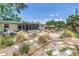Well-designed backyard featuring xeriscaping, a screened-in porch, and unique hardscape, perfect for relaxing outdoors at 11376 119Th Ter, Largo, FL 33778