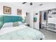 Comfortable bedroom with teal accent wall, closet, and view to the backyard at 11376 119Th Ter, Largo, FL 33778