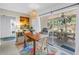 Bright dining room featuring a wood table, rattan chairs, and sliding glass doors to an outdoor patio at 11376 119Th Ter, Largo, FL 33778