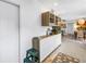 Transitional dining space with custom shelving and built-in cabinets adjacent to the main kitchen at 11376 119Th Ter, Largo, FL 33778