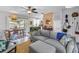 Open-concept living space with kitchen view, cozy seating, and seamless indoor-outdoor flow at 11376 119Th Ter, Largo, FL 33778